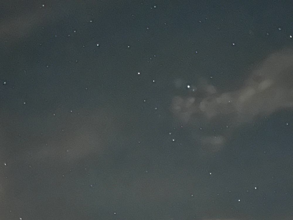A starry night sky with thin clouds over Fannin County, Georgia