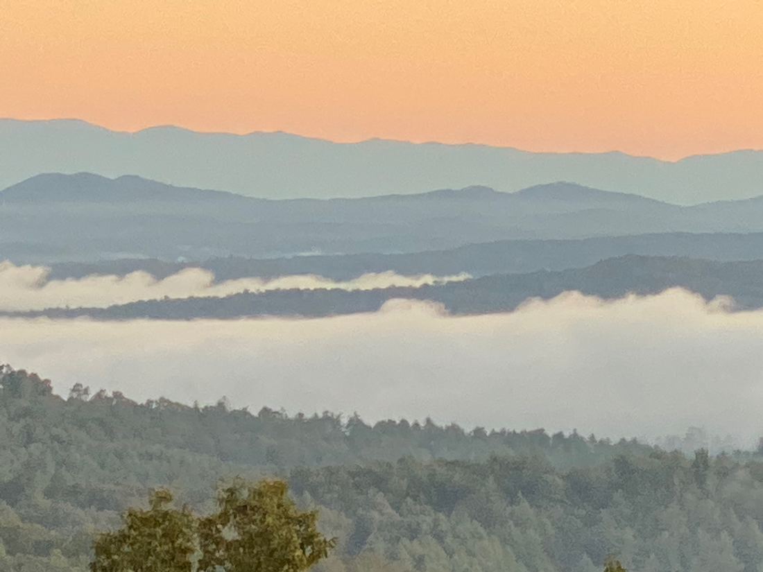 Dawn fog filling the valleys below the Blue Ridge mountains in Fannin County, Georgia